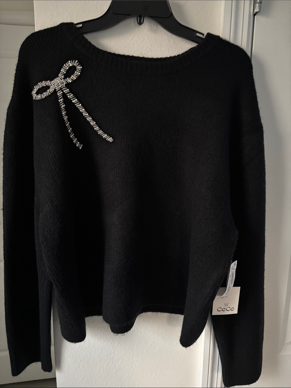 CeCe Black Crewneck Sweater with Rhinestone Bow